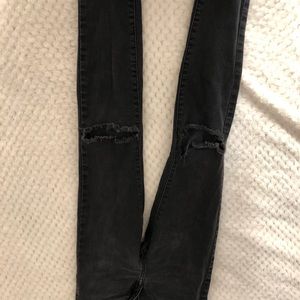 Black knee ripped jeans